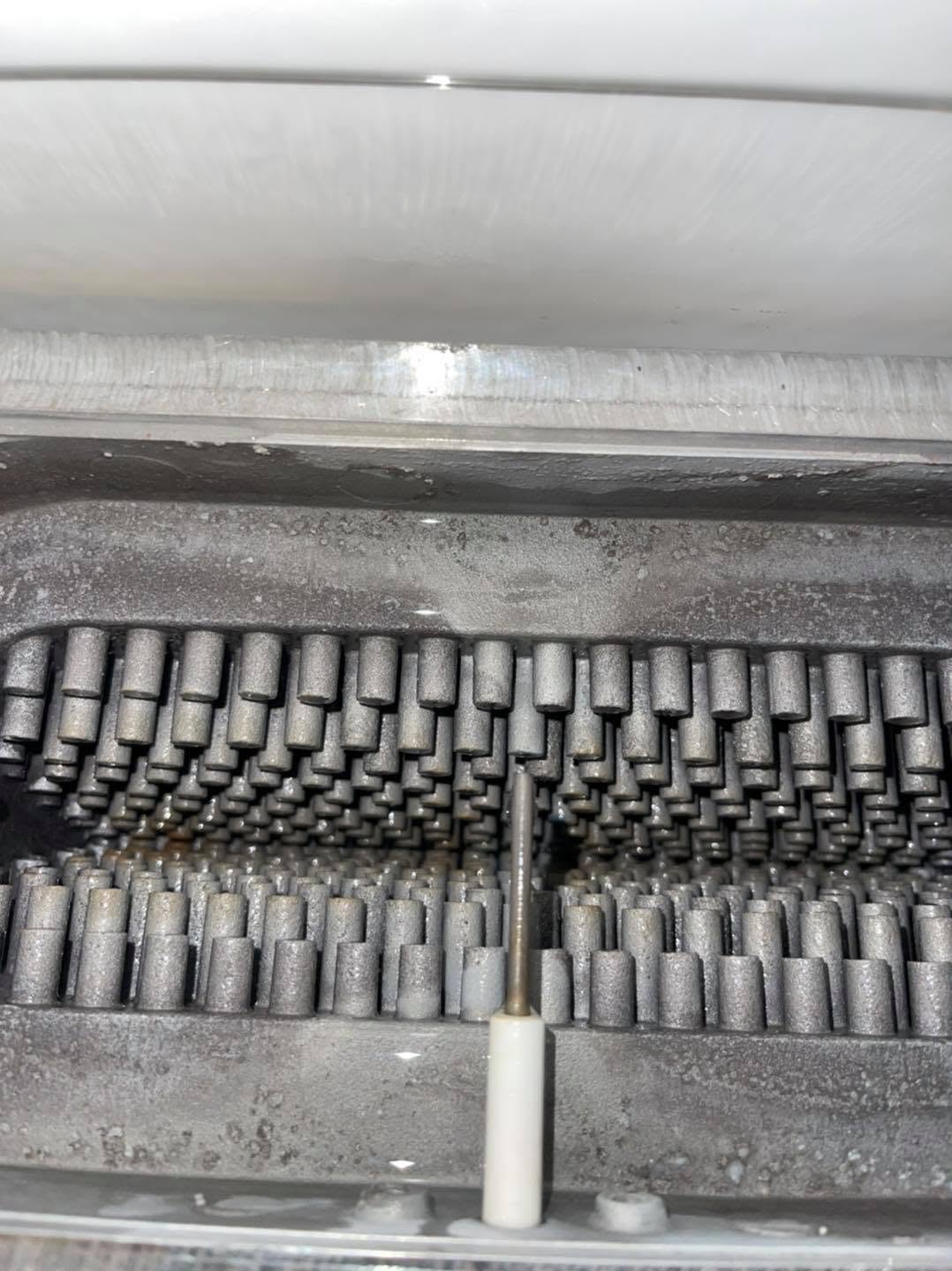 Heat exchanger pins inside a boiler during a service
